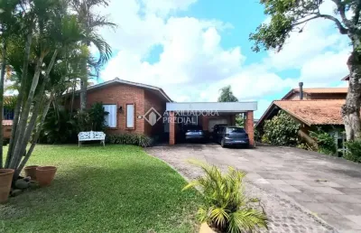 Casa em condomínio fechado com 5 quartos à venda na avenida firmino octávio bimbi, 255, cavalhada, porto alegre, 274 m2 por r$ 1.390.000