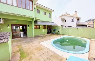 Casa em condomínio fechado com 3 quartos à venda na rua louro, 34, hípica, porto alegre, 167 m2 por r$ 650.000