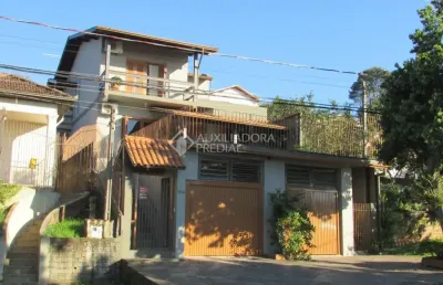 Casa em condomínio fechado com 3 quartos à venda na rua espanha, 184, rincão, novo hamburgo, 187 m2 por r$ 498.000