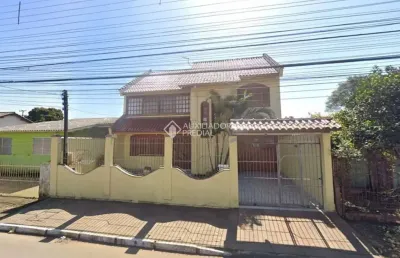 Casa em condomínio fechado com 3 quartos à venda na rua buttenbender, 905, fátima, canoas, 244 m2 por r$ 779.900