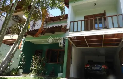Casa em condomínio fechado com 3 quartos à venda na rua márcio dias, 176, nonoai, porto alegre, 317 m2 por r$ 780.000