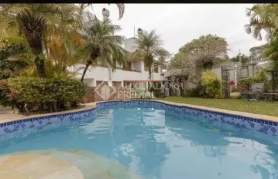 Casa em condomínio fechado com 5 quartos à venda na rua gustavo schmidt, 277, três figueiras, porto alegre, 445 m2 por r$ 3.200.000