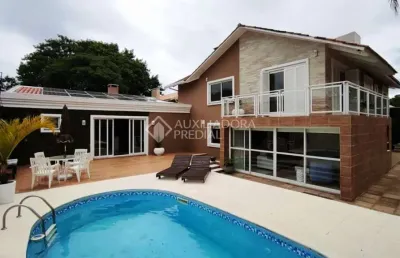 Casa com 3 quartos à venda na rua jacundá, 273, guarujá, porto alegre, 270 m2 por r$ 1.046.000