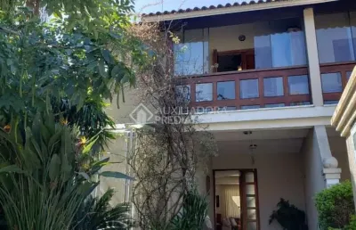 Casa em condomínio fechado com 3 quartos à venda na avenida eduardo prado, 2050, cavalhada, porto alegre, 300 m2 por r$ 959.000