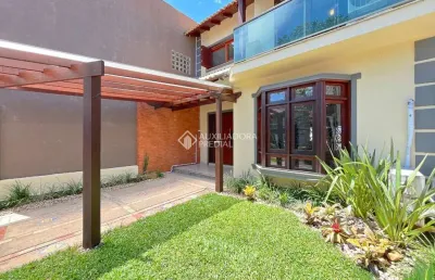 Casa em condomínio fechado com 3 quartos à venda na rua roberto santini, 194, hípica, porto alegre, 138 m2 por r$ 720.000