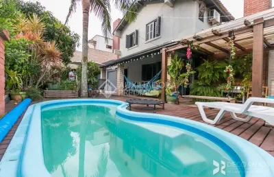 Casa em condomínio fechado com 3 quartos à venda na estrada joão passuelo, 1060, vila nova, porto alegre, 230 m2 por r$ 520.000