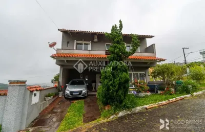 Casa em condomínio fechado com 3 quartos à venda na avenida altos do santa rita, 441, vila operária, porto alegre, 274 m2 por r$ 890.000