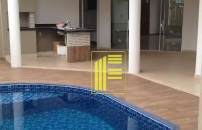 Aluga-se casa em condomínio com 04 dormitórios, 05 wc, escritório, piscina.
