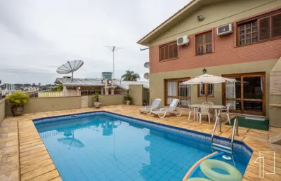 Casa com 4 quartos à venda na rua três de outubro, 172, pátria nova, novo hamburgo por r$ 809.000