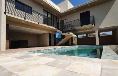 Linda casa térra em condomínio terras de siena - 3 suítes, escritório, piscina