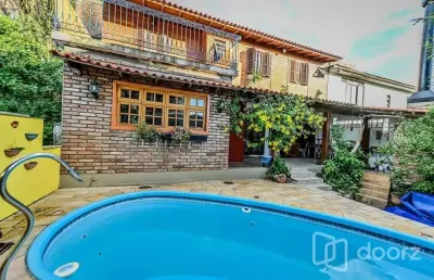 Casa em condomínio fechado com 4 quartos à venda na das figueiras, 108, santa tereza, porto alegre, 200 m2 por r$ 650.000