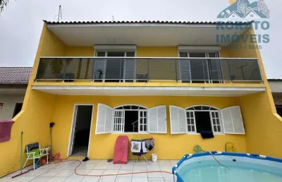 Sobrado 5 dormitórios apenas 3 quadras do mar em albatroz