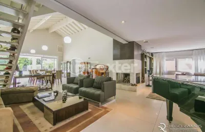 Casa em condomínio fechado com 4 quartos à venda na avenida juca batista, 8000, belém novo, porto alegre, 414 m2 por r$ 2.690.000
