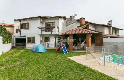 Casa com 5 quartos à venda na rua fortunato della casa, 35, espírito santo, porto alegre, 243 m2 por r$ 1.520.000