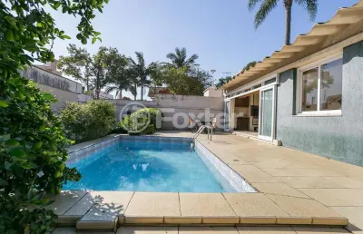 Casa com 4 quartos à venda na rua alfredo schuett, 833, três figueiras, porto alegre, 348 m2 por r$ 1.800.000