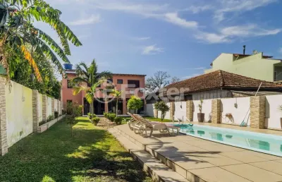Casa com 3 quartos à venda na rua humberto de campos, 1267, partenon, porto alegre, 218 m2 por r$ 1.100.000