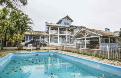 Casa com 4 quartos à venda na rua marquês do maricá, 444, vila nova, porto alegre, 360 m2 por r$ 1.300.000
