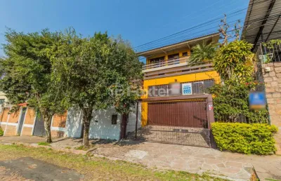 Casa com 3 quartos à venda na rua coronel ruy da cunha paim, 35, nonoai, porto alegre, 294 m2 por r$ 899.000