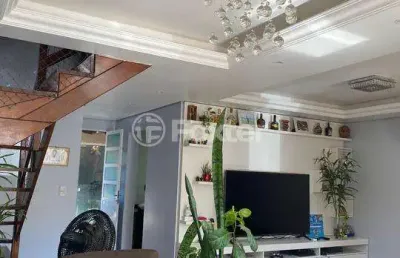 Casa em condomínio fechado com 3 quartos à venda na avenida joão ferreira jardim, 140, parque santa fé, porto alegre, 146 m2 por r$ 530.000