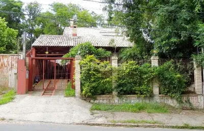 Casa com 5 quartos à venda na avenida heitor vieira, 794, belém novo, porto alegre, 132 m2 por r$ 700.000