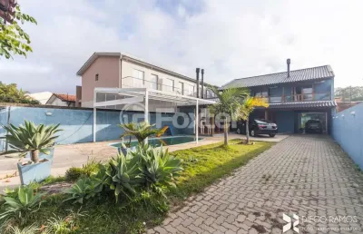 Casa com 4 quartos à venda na rua jerolomo minuzo, 317, vila nova, porto alegre, 304 m2 por r$ 900.000
