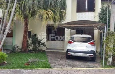 Casa em condomínio fechado com 3 quartos à venda na avenida juca batista, 4115, hípica, porto alegre, 99 m2 por r$ 499.000