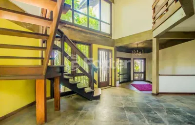 Casa com 5 quartos à venda na avenida guaíba, 4556, vila assunção, porto alegre, 349 m2 por r$ 1.800.000