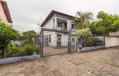 Casa com 4 quartos à venda na rua santa flora, 944, nonoai, porto alegre, 248 m2 por r$ 950.000