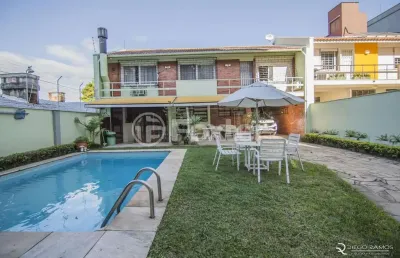 Casa com 3 quartos à venda na rua alcides gonzaga, 50, boa vista, porto alegre, 350 m2 por r$ 1.805.000