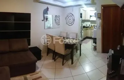 Casa em condomínio fechado com 2 quartos à venda na avenida guarujá, 126, guarujá, porto alegre, 105 m2 por r$ 342.000