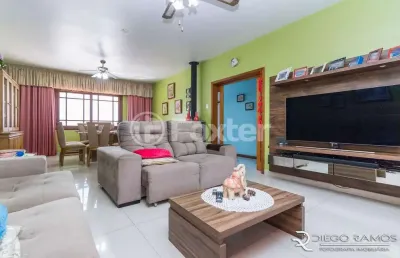 Casa com 4 quartos à venda na travessa afonso mabilde, 111, santa maria goretti, porto alegre, 247 m2 por r$ 1.090.000