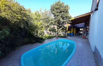 Casa com 4 quartos à venda na rua osvaldo aranha, 236, formoza, alvorada, 177 m2 por r$ 400.000