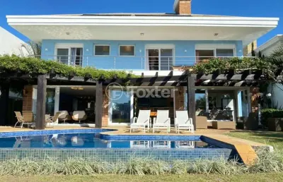 Casa em condomínio fechado com 5 quartos à venda na avenida central, 2500, atlântida, xangri-lá, 400 m2 por r$ 4.560.000
