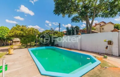Casa com 4 quartos à venda na rua ary veiga sanhudo, 71, vila nova, porto alegre, 220 m2 por r$ 712.004