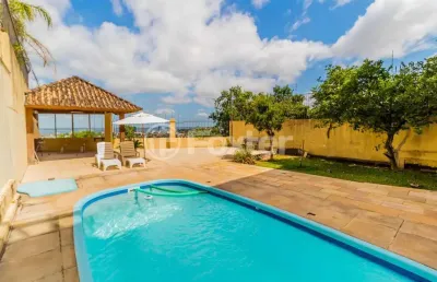 Casa com 4 quartos à venda na rua alcebíades antônio dos santos, 379, nonoai, porto alegre, 375 m2 por r$ 1.805.000