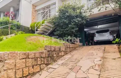 Casa com 3 quartos à venda na rua gustavo schmidt, 332, três figueiras, porto alegre, 227 m2 por r$ 1.275.000