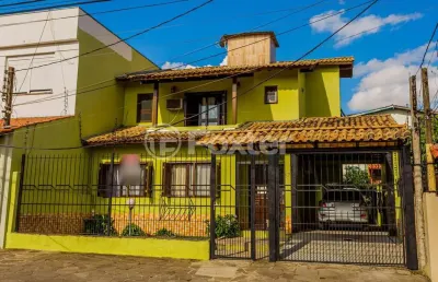 Casa com 3 quartos à venda na avenida doutor rubem knijnik, 87, parque santa fé, porto alegre, 239 m2 por r$ 900.000