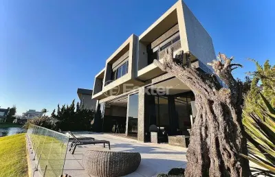 Casa em condomínio fechado com 6 quartos à venda na rua rio jacuí, 1331, centro, xangri-lá, 486 m2 por r$ 8.050.000