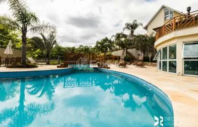Casa em condomínio fechado com 4 quartos à venda na avenida engenheiro ludolfo boehl, 1179, teresópolis, porto alegre, 233 m2 por r$ 990.000
