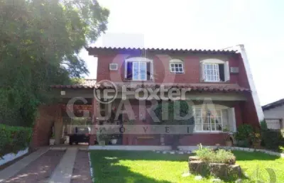 Casa com 3 quartos à venda na rua dos guenoas, 796, guarujá, porto alegre, 298 m2 por r$ 901.000