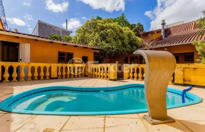 Casa com 2 quartos à venda na rua afonso rodrigues, 263, jardim botânico, porto alegre, 194 m2 por r$ 1.150.000