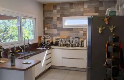 Casa em condomínio fechado com 3 quartos à venda na avenida senador salgado filho, 8500, querência, viamão, 228 m2 por r$ 1.150.000