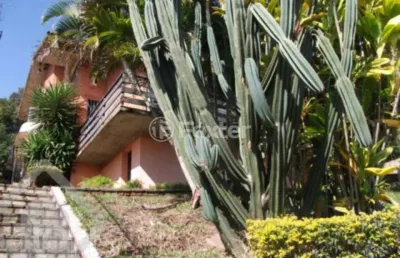 Casa com 4 quartos à venda na rua alcebíades antônio dos santos, 260, nonoai, porto alegre, 240 m2 por r$ 900.000