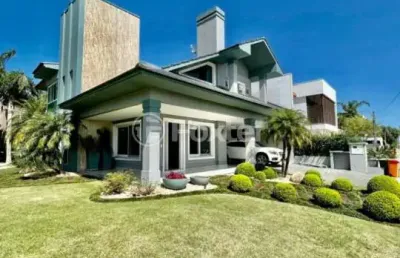 Casa em condomínio fechado com 4 quartos à venda na avenida central, 2000, zona nova, capão da canoa, 268 m2 por r$ 2.400.000