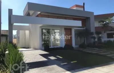 Casa em condomínio fechado com 3 quartos à venda na avenida central, 2000, zona nova, capão da canoa, 180 m2 por r$ 1.550.000