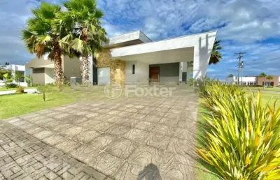 Casa em condomínio fechado com 3 quartos à venda na avenida central, 2009, zona nova, capão da canoa, 196 m2 por r$ 1.190.000