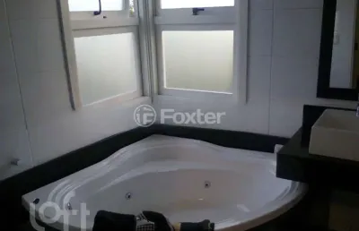Casa em condomínio fechado com 3 quartos à venda na rua guatambu, 833, hípica, porto alegre, 256 m2 por r$ 800.000
