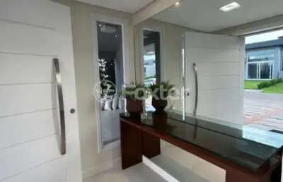 Casa em condomínio fechado com 4 quartos à venda na rua honorio ferreira da silva, 2009, arco íris, capão da canoa, 230 m2 por r$ 1.860.000