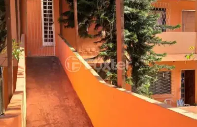 Casa com 4 quartos à venda na avenida vicente monteggia, 283, cavalhada, porto alegre, 200 m2 por r$ 640.000
