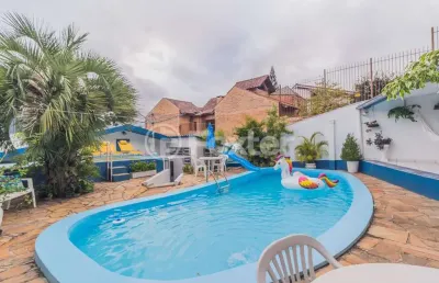Casa com 4 quartos à venda na rua santo camaratta-santino, 6, parque santa fé, porto alegre, 176 m2 por r$ 742.000